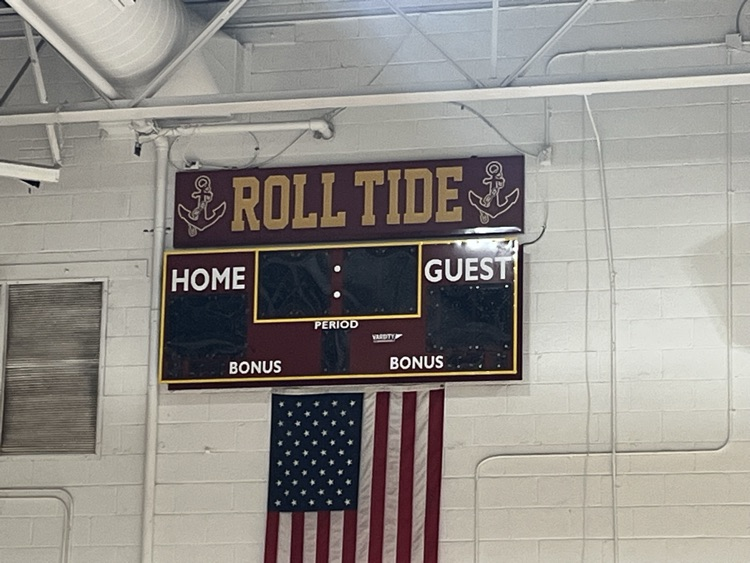 Score boards on a gym wall