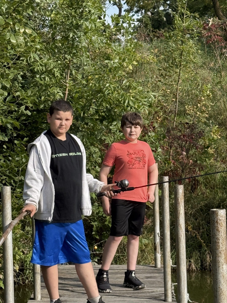 two male students fishing