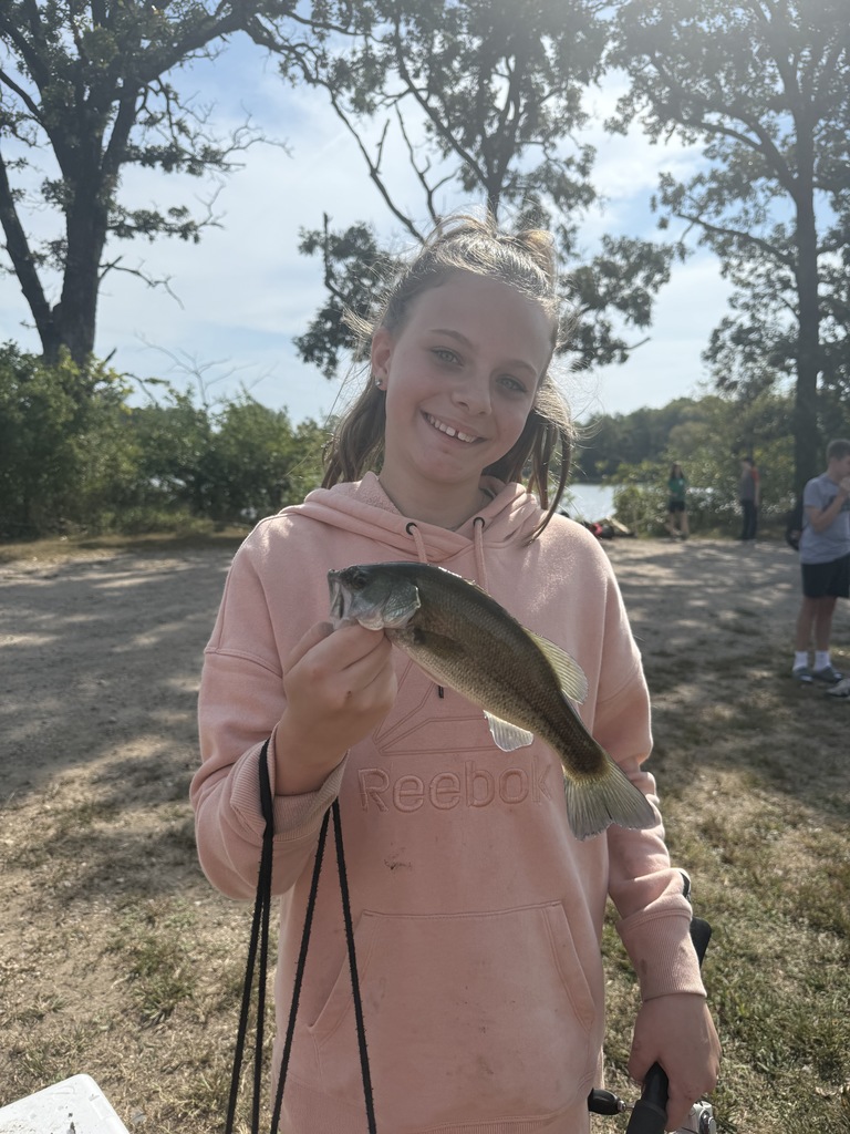 female student holding a fish