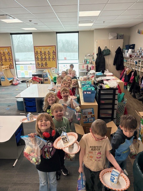 Preschool students with their gingerbread houses