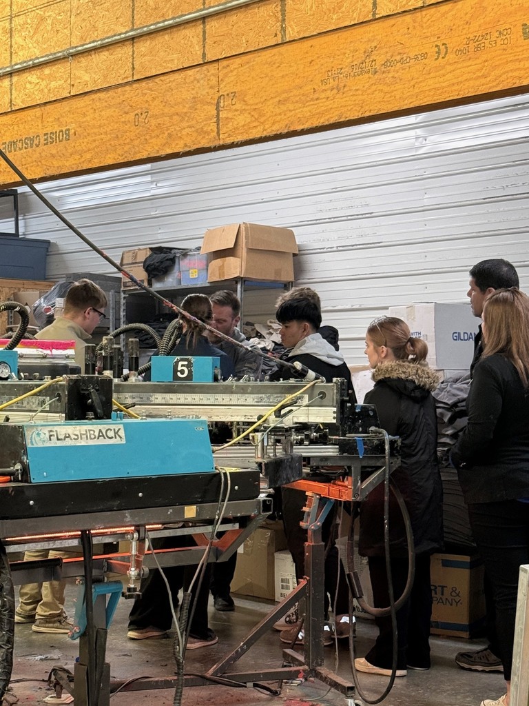 Upper Iowa and Boone students touring a business