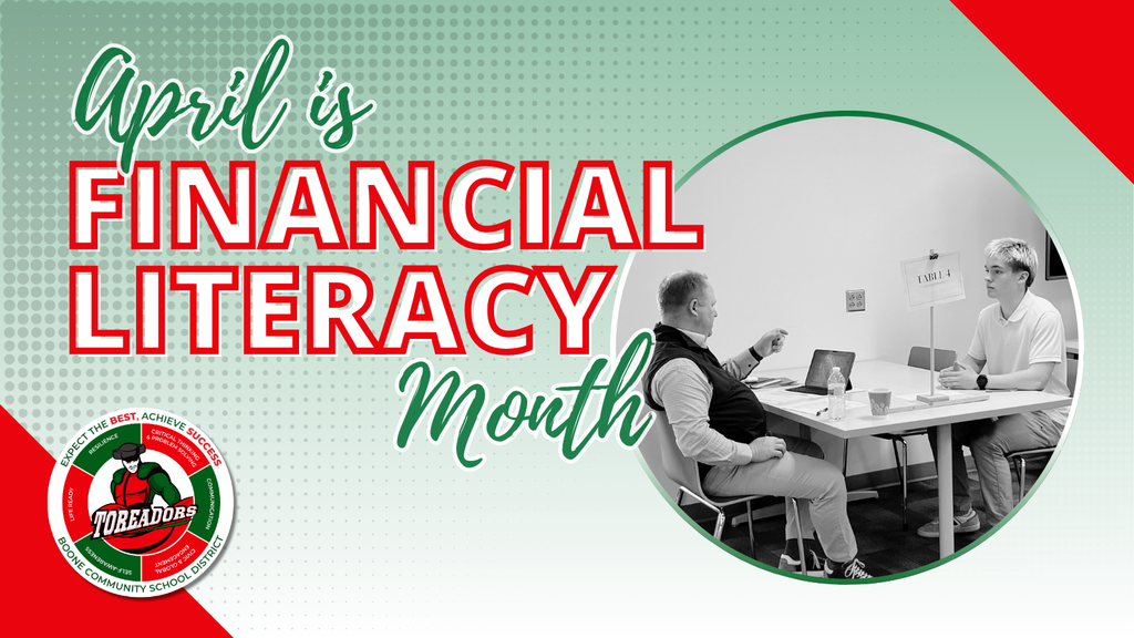 Two people discussing finances at a table with laptops during Financial Literacy Month in April.