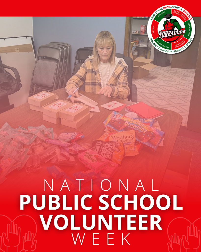 Volunteer organizing care packages with snacks and notes at a community school table for National Public School Volunteer Week.