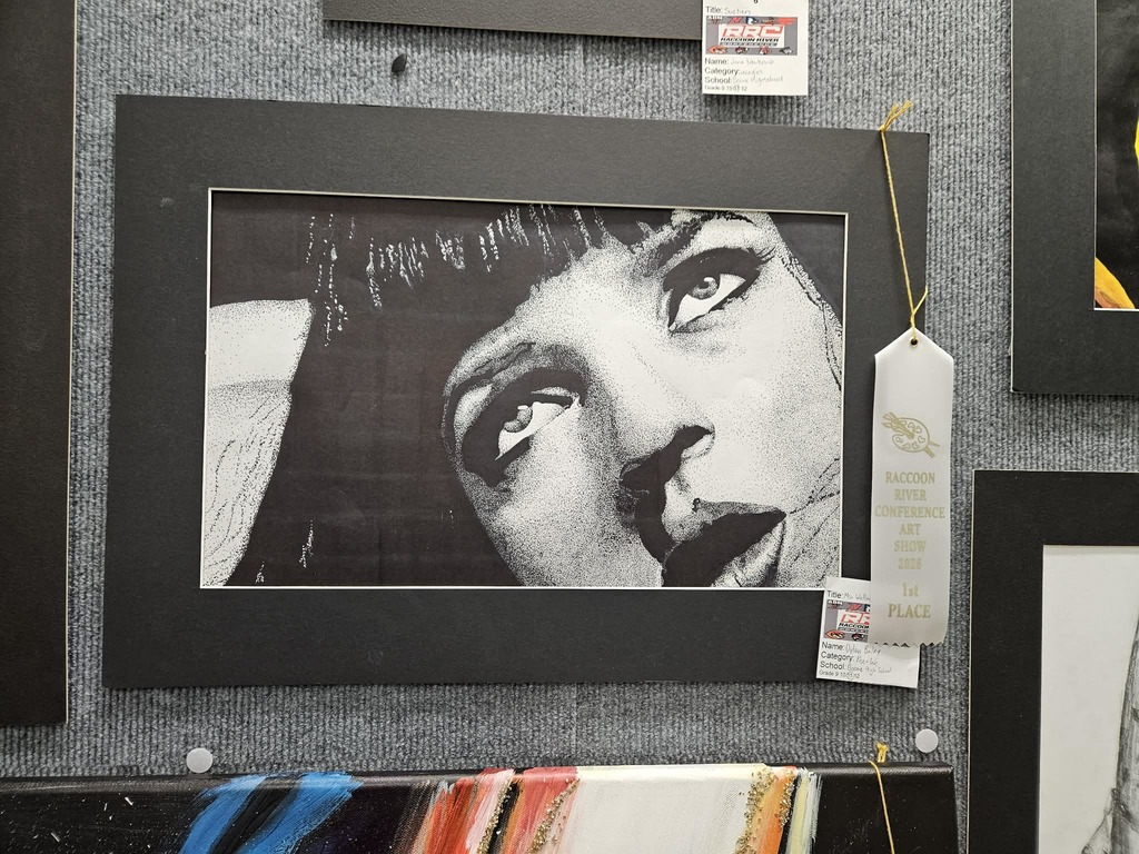 Black and white drawing of a female face.