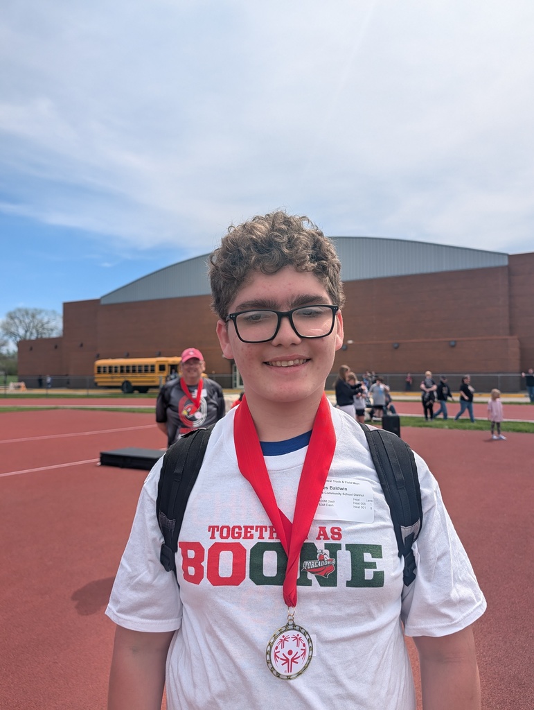 Student wearing Boone shirt with medal around neck.