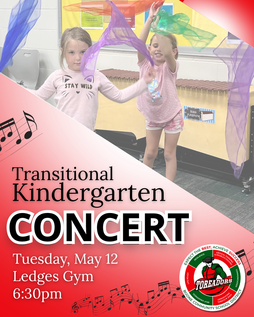 Two young children waving colorful scarves during a kindergarten concert rehearsal in a gym setting.