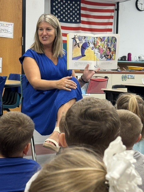 Ms. Sifflard reads aloud to BES 1st graders