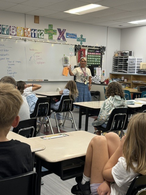 Mrs. Pierce reads aloud to new third graders at BES