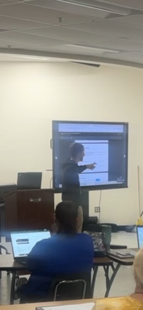 Mr. Guernsey shares at the staff meeting