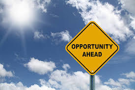 yellow sign stating opportunity ahead