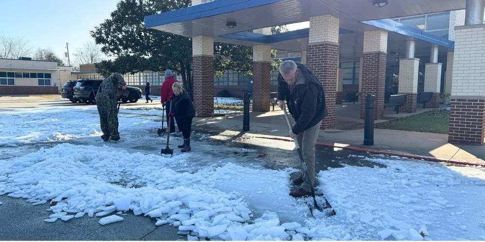 Jason Rowland and Rachael Stroud at Plantation Park are cleaning up after the ice storm