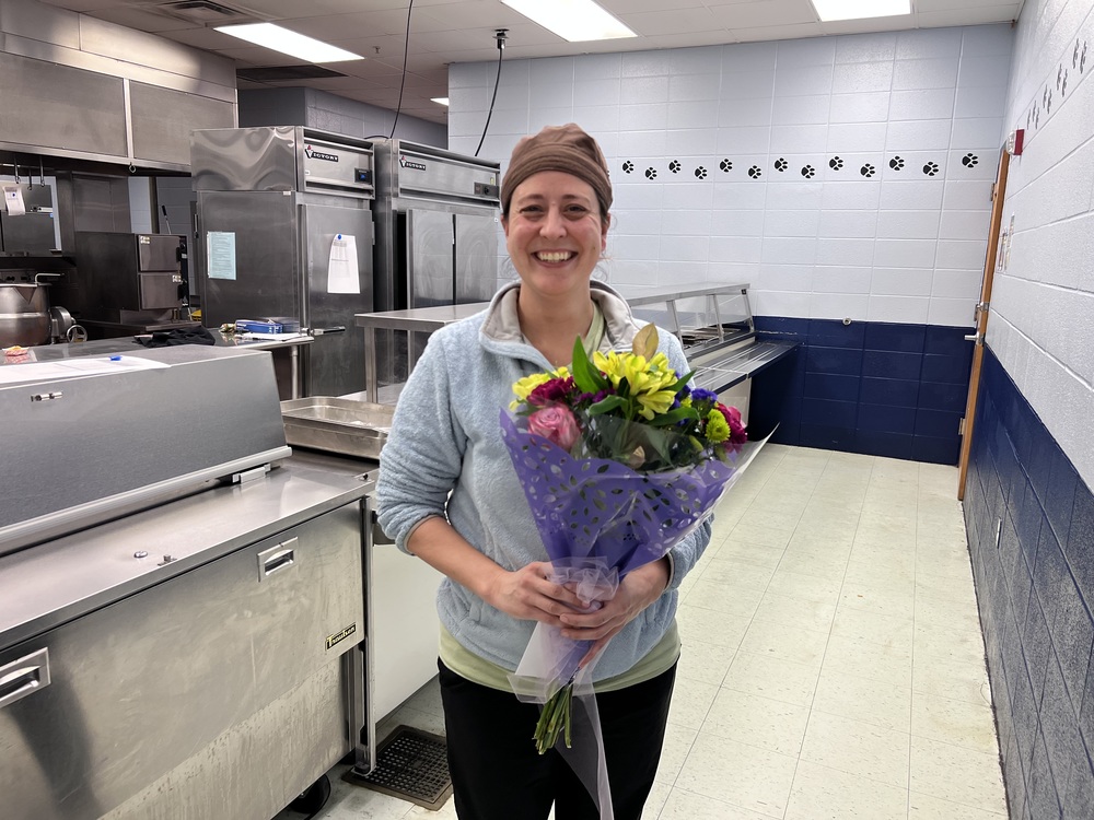 Photo of Alexis Huckabee holding a bouquet of flowers