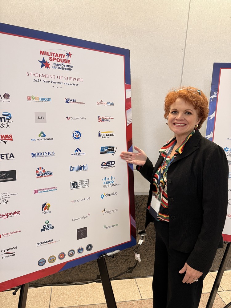 Photo of Teri Howe showing BPSB logo on a sign