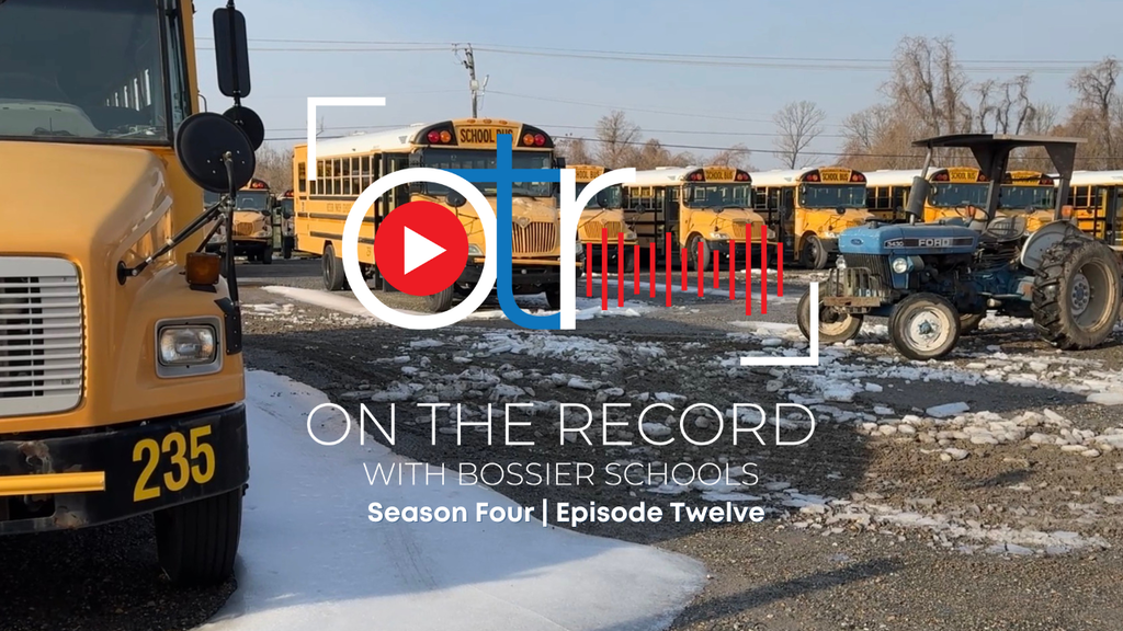 School buses  parked on an icy parking lot