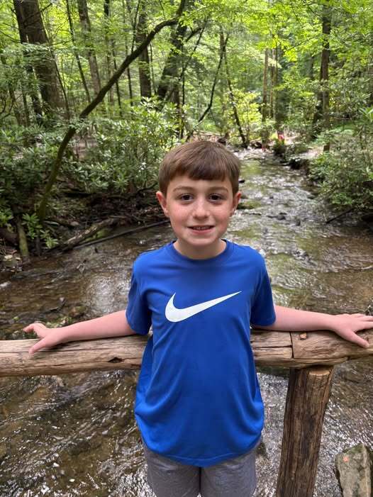 Hays Cahn poses in front of a creek