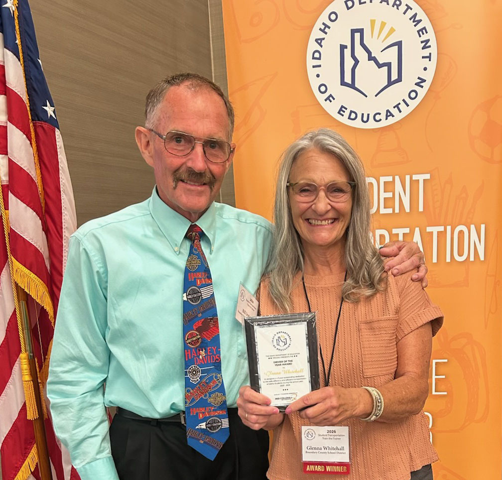 Image of BCSD#101 transportation supervisor, Bill Irwin (left), and school bus driver, Glenna Whitehall (right). Glenna is receiving an award for Idaho Driver of the Year.