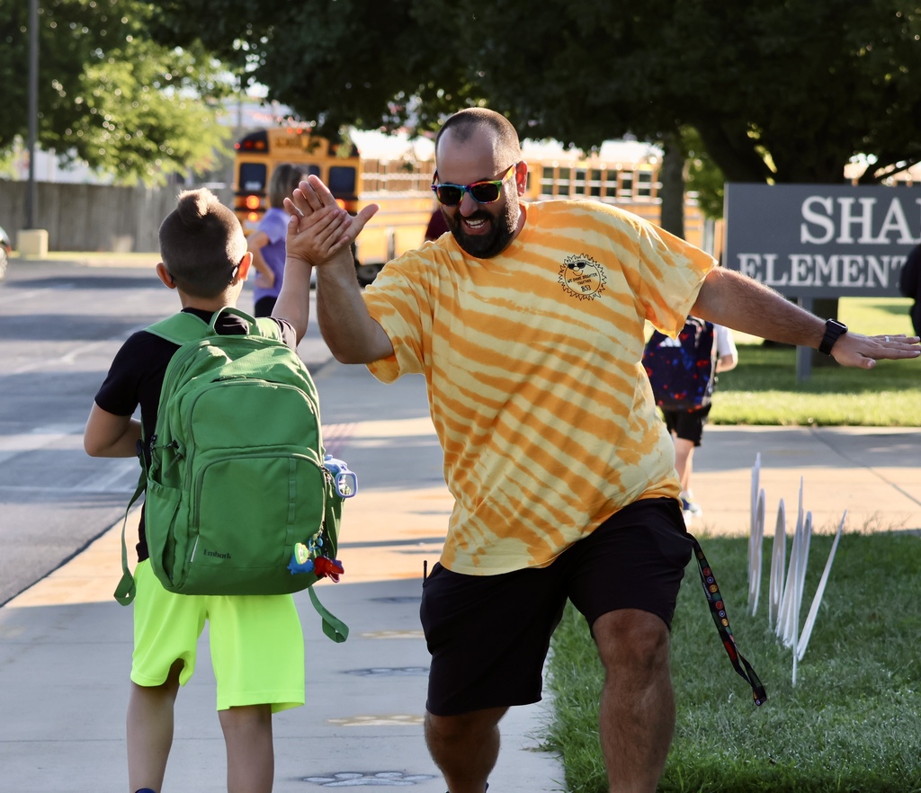 Mr Blyle high fiving student