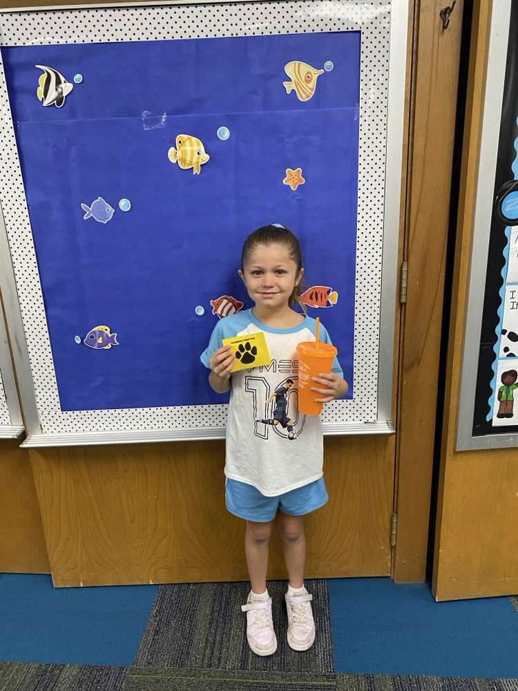 student with golden Tiger paw and prize 