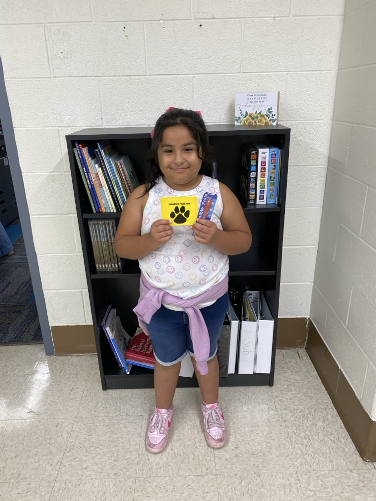 student with golden Tiger paw and prize 