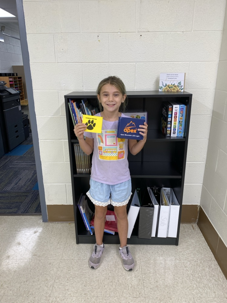 student with golden Tiger paw and prize 