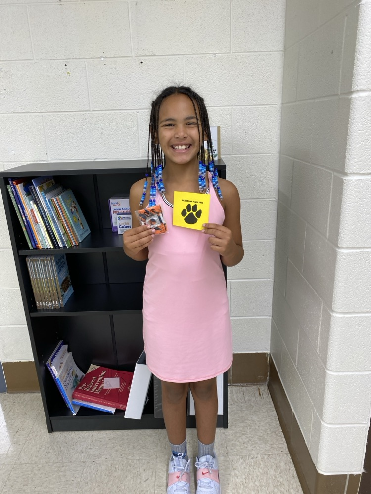 student with golden Tiger paw and prize 
