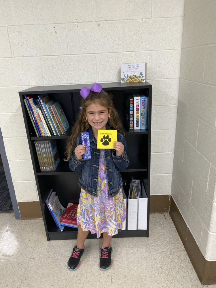 student with golden Tiger paw and prize 