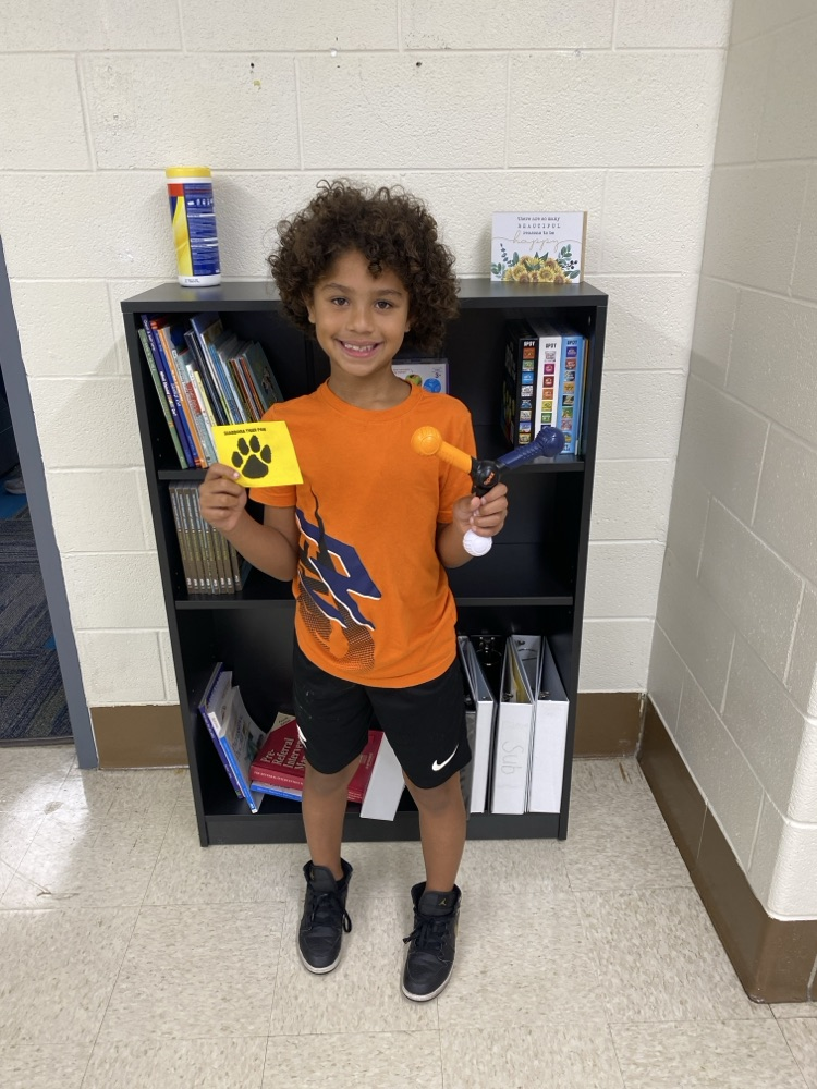student with golden Tiger paw and prize 