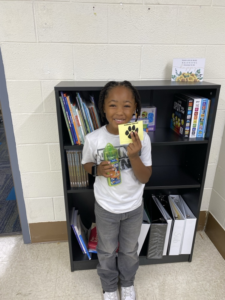 student with golden Tiger paw and prize 