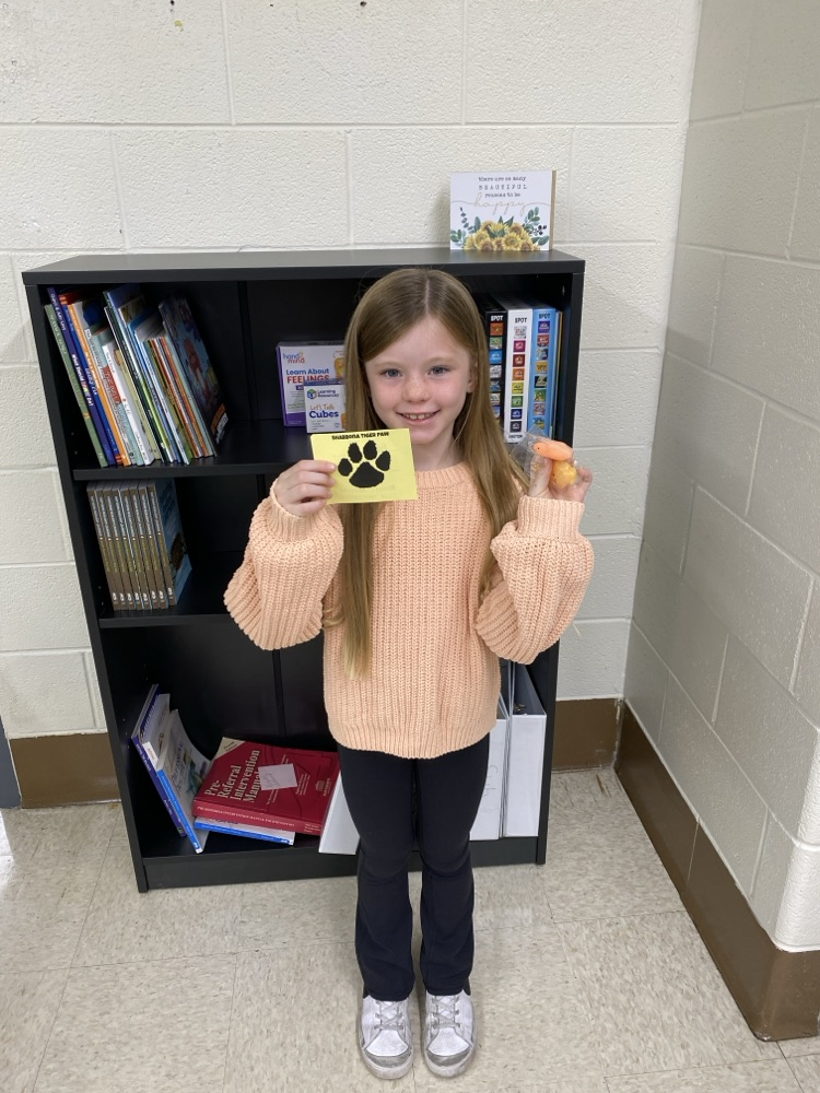  student with golden Tiger paw and prize 