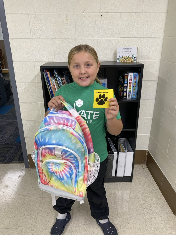 student with golden Tiger paw and prize 