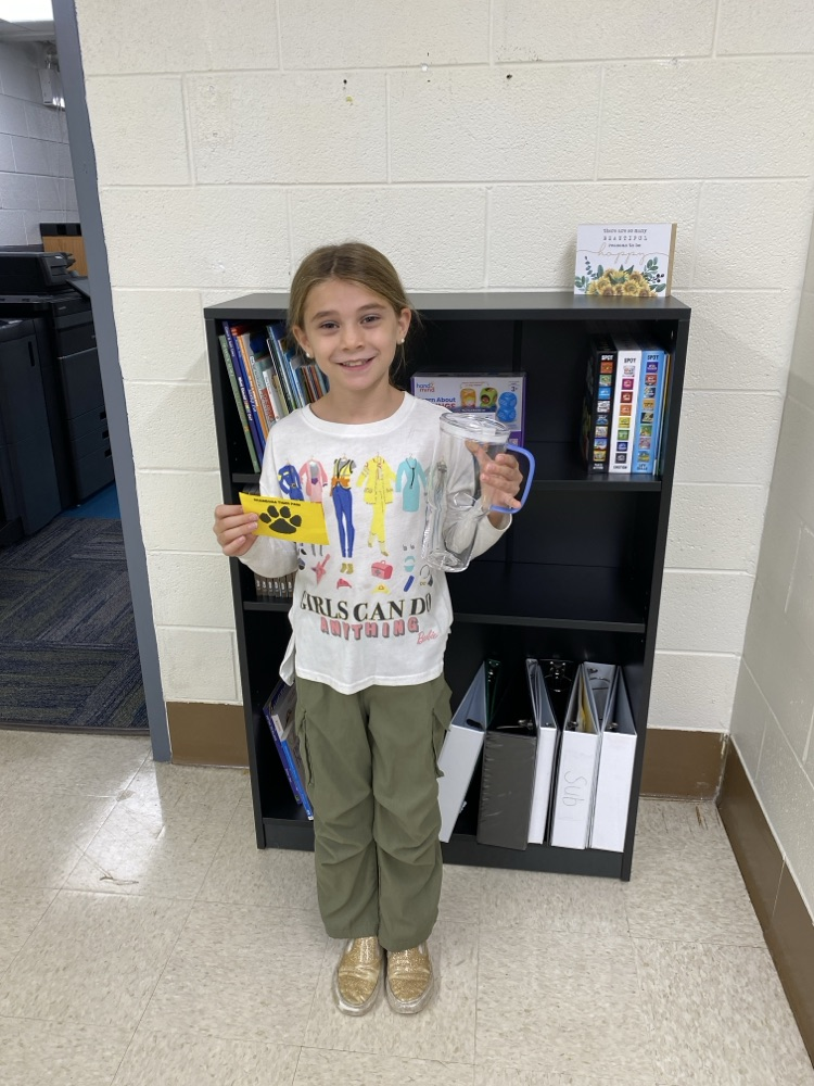 student with golden Tiger paw and prize 