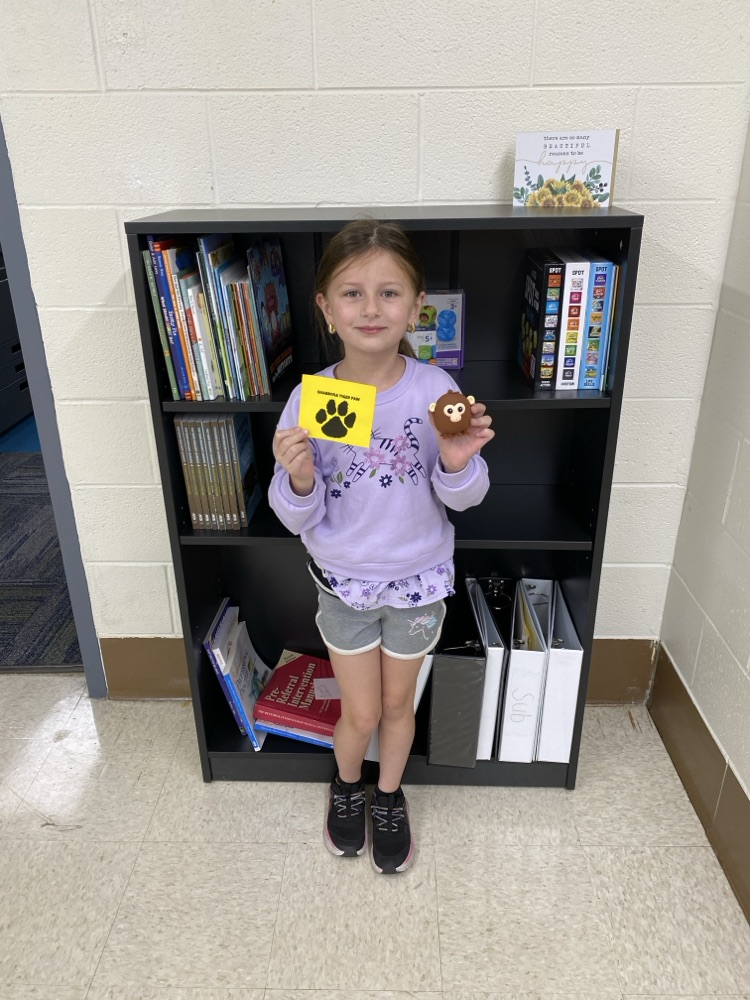 student with golden Tiger paw and prize 