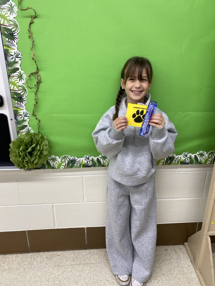 student with golden Tiger paw and prize 