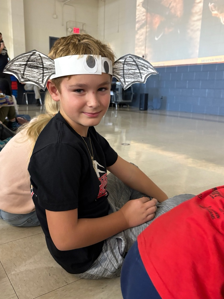 student with bat headband 