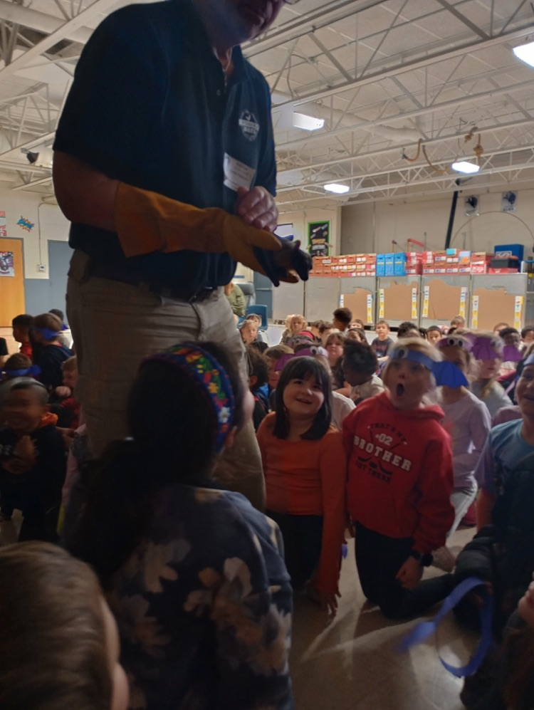 the students in awe looking at the bat