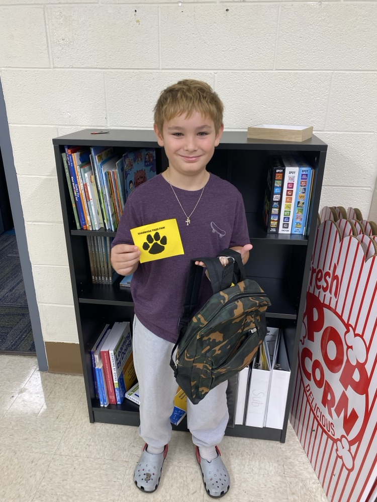 student with golden Tiger prize