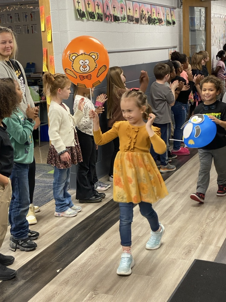 student with balloon
