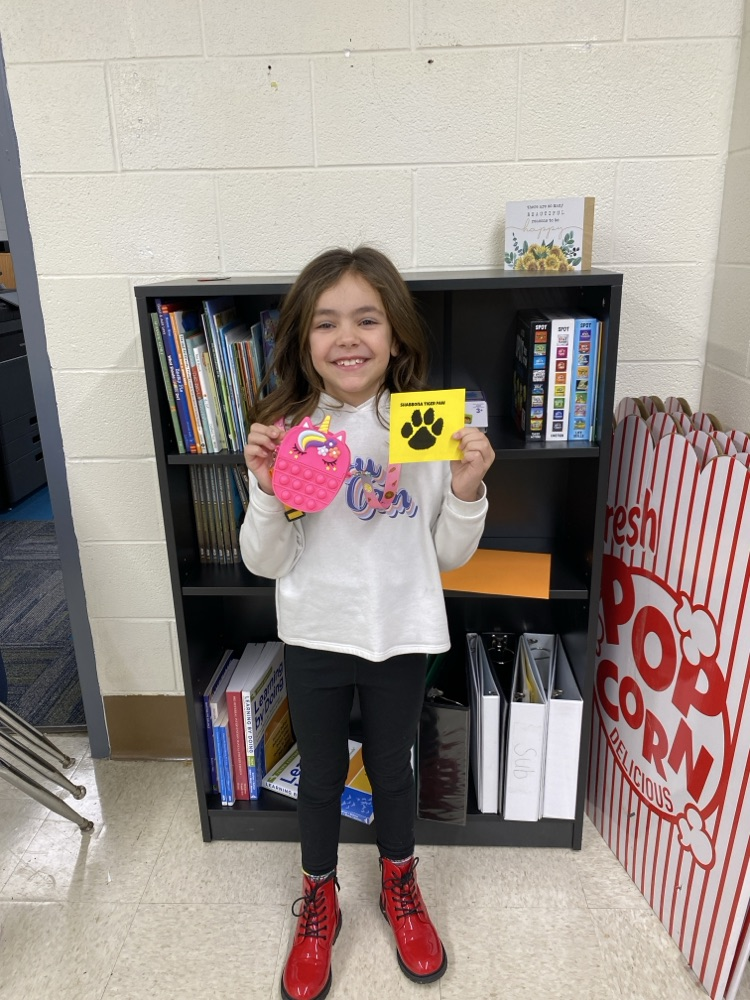 student with tiger paw prize