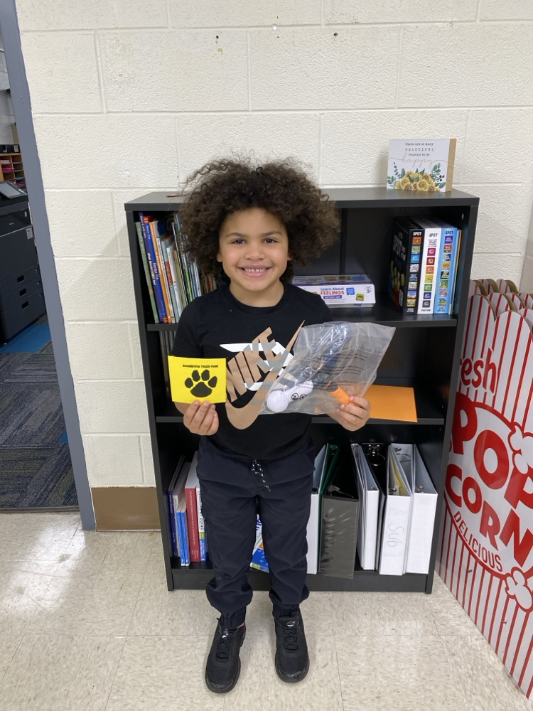 student with tiger paw prize
