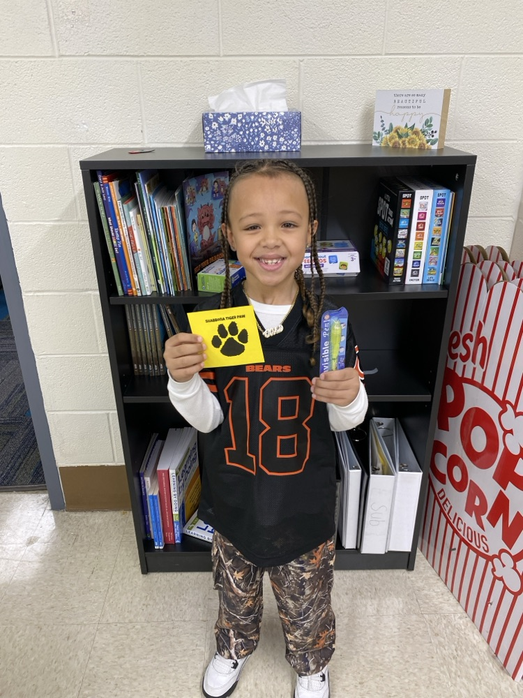 student with tiger paw prize