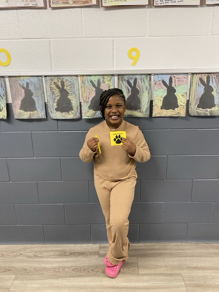 student with tiger paw reward