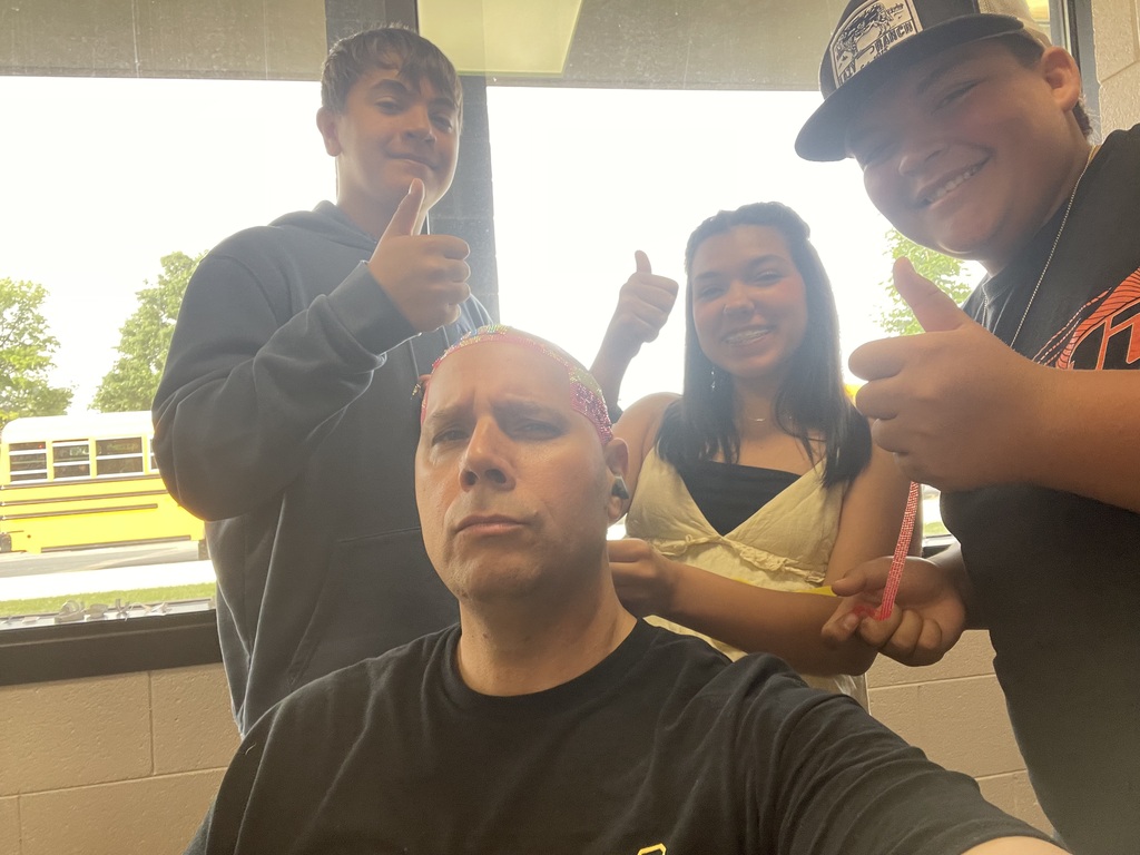  Members of the BUGC Student Life Group bedazzle Mr. Chorak’s head for the End of Year Celebration