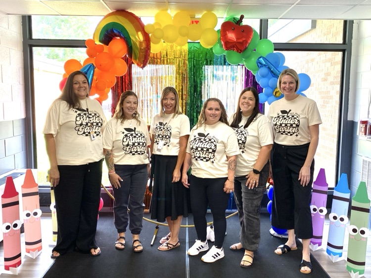 kindergarten under the rainbow balloon arch