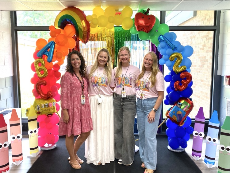 1st grade under the rainbow balloon arch