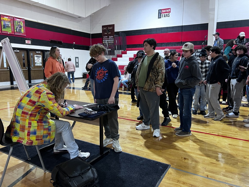 students waiting for autograph