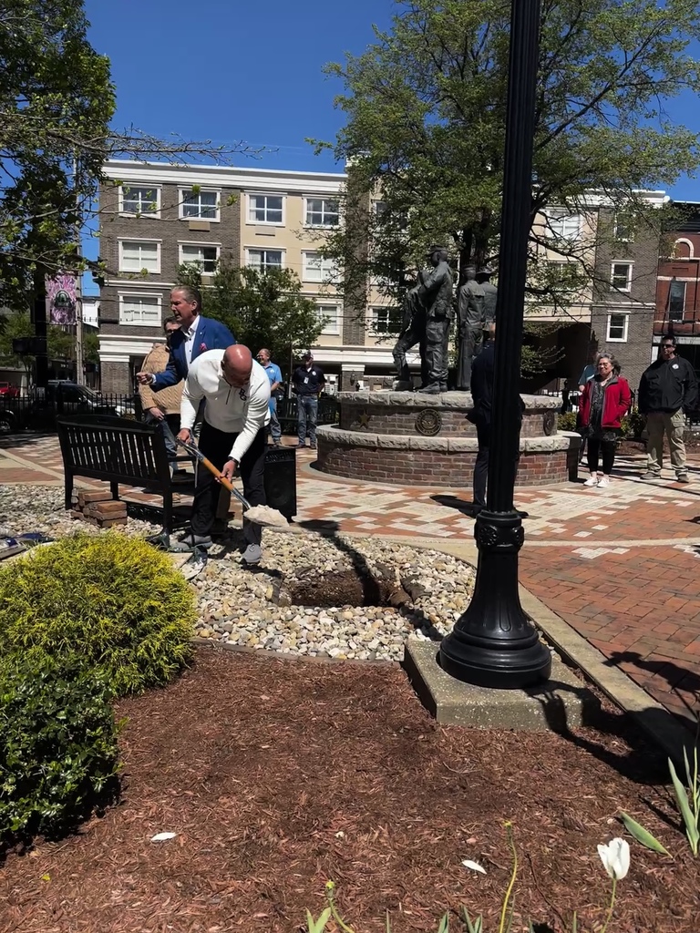 Superintendent Gary Fields helps bury the BG 2050 Time Capsule