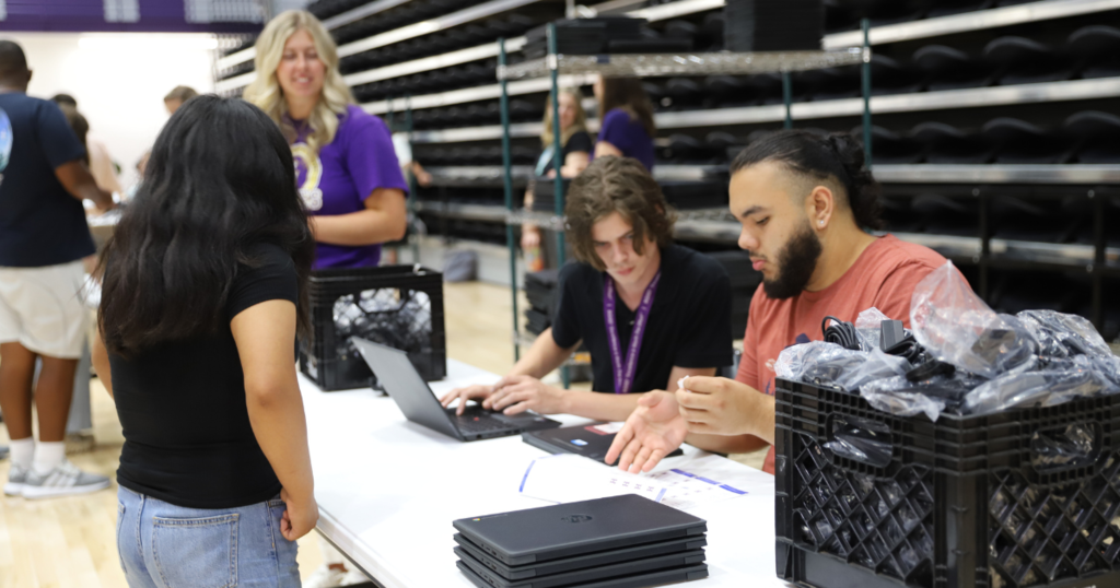 Passing out Chromebooks at BGHS