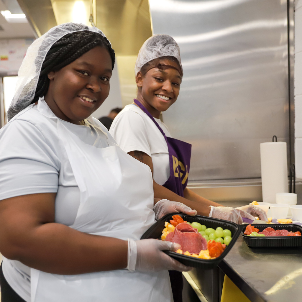 Culinary Arts students showing teacher box