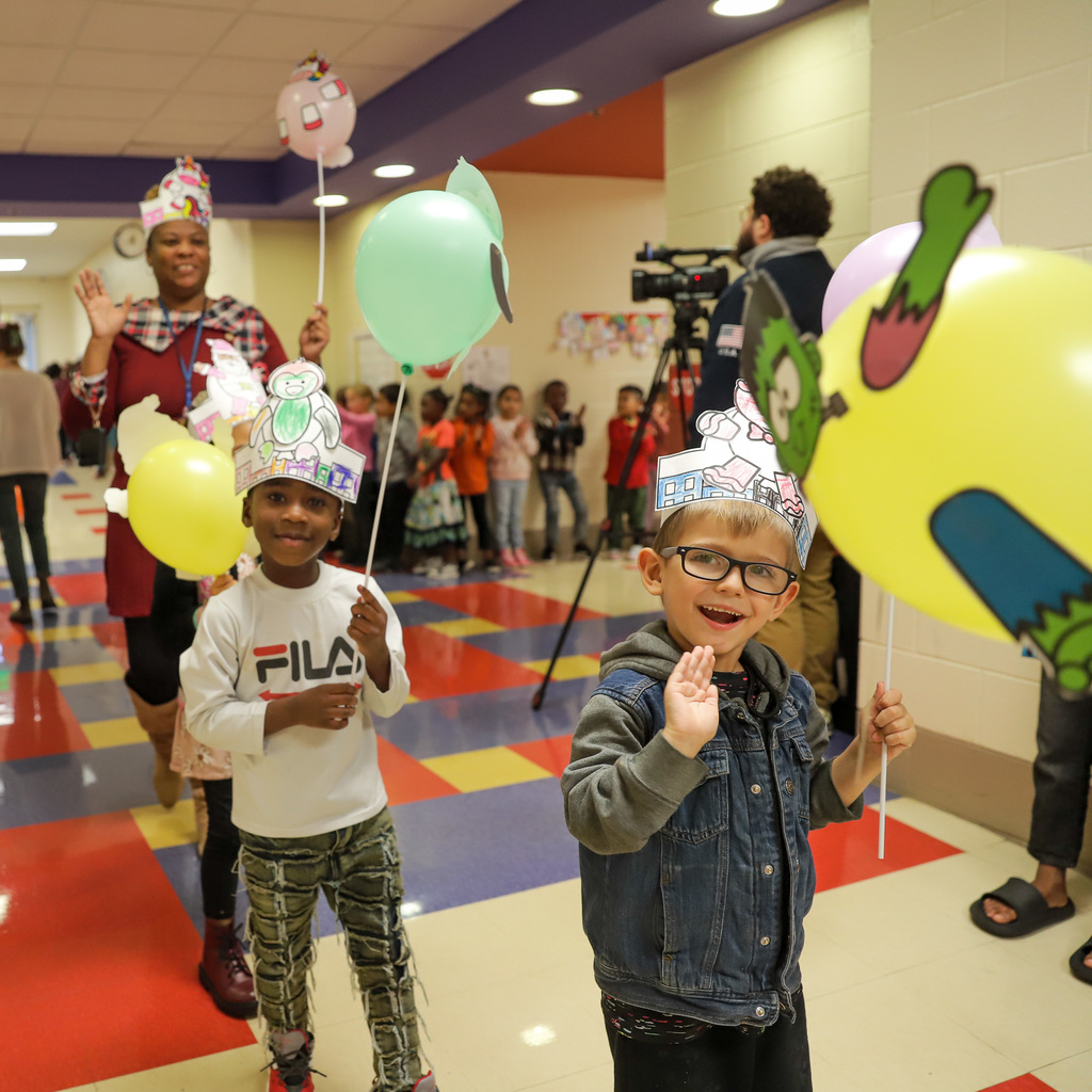 Balloon parade boy waving