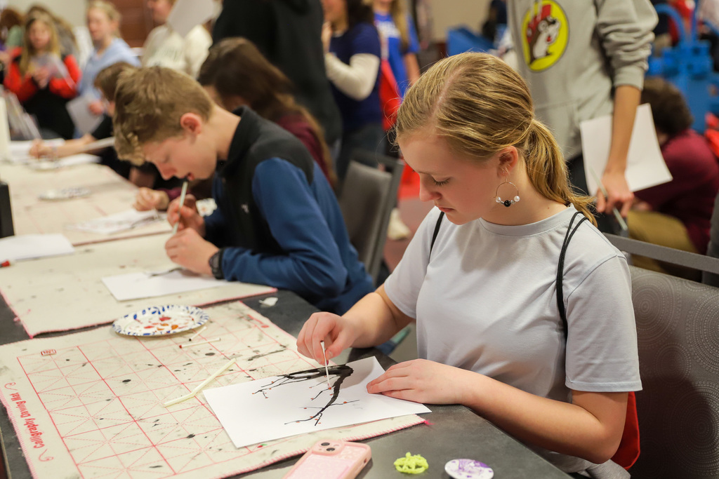 Student painting tree
